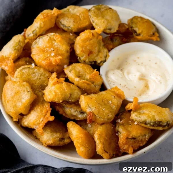 Crispy Beer Batter Recipe for Perfect Fried Fish and Vegetables 7 Bowl of fried pickle bites with garlic mayo.