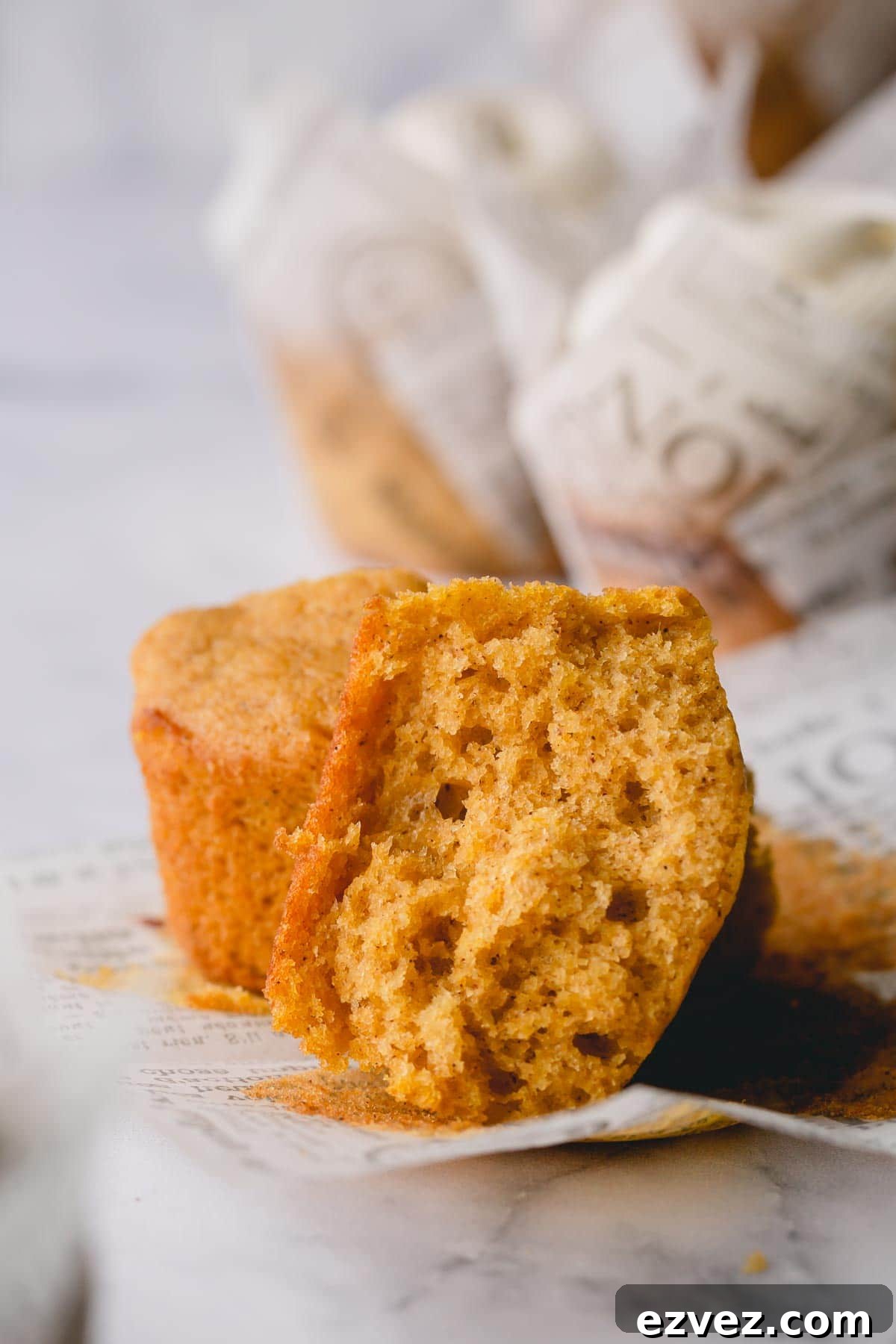 Sliced pumpkin cupcake to show the fluffy inside texture.