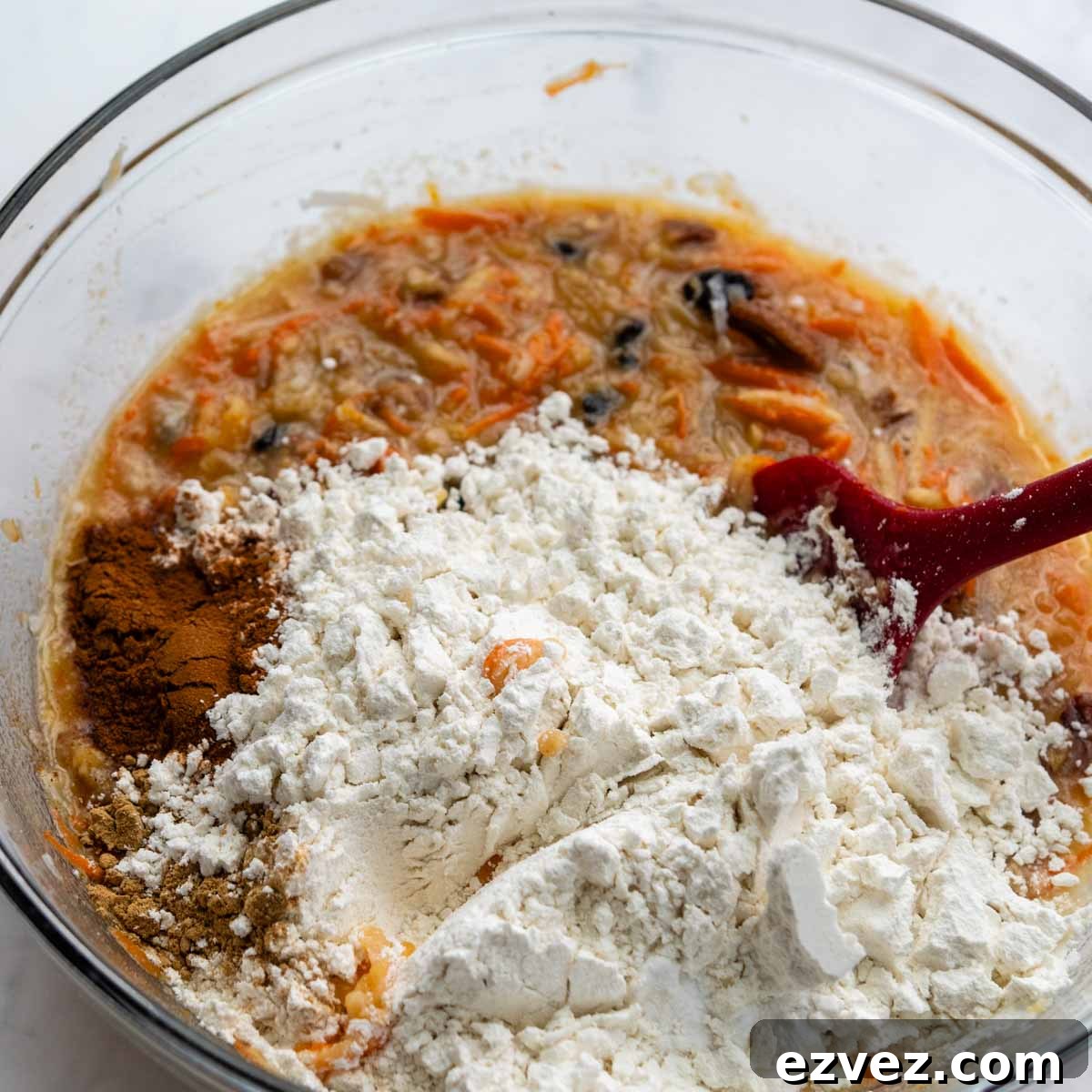the dry ingredients being mixed into the bowl.
