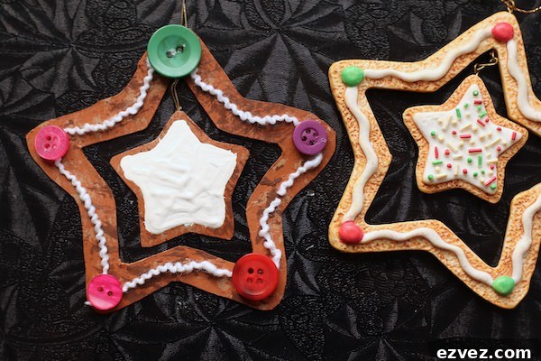 painted cardboard star with yarn and buttons glued on