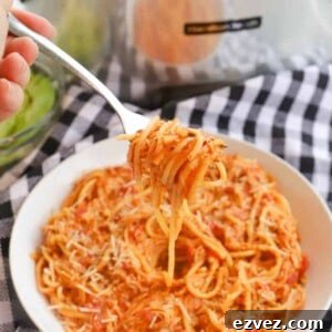 Creamy Tomato Chicken Spaghetti Made in a Slow Cooker 7 Slow Cooker Creamy Tomato Chicken Spaghetti on a fork