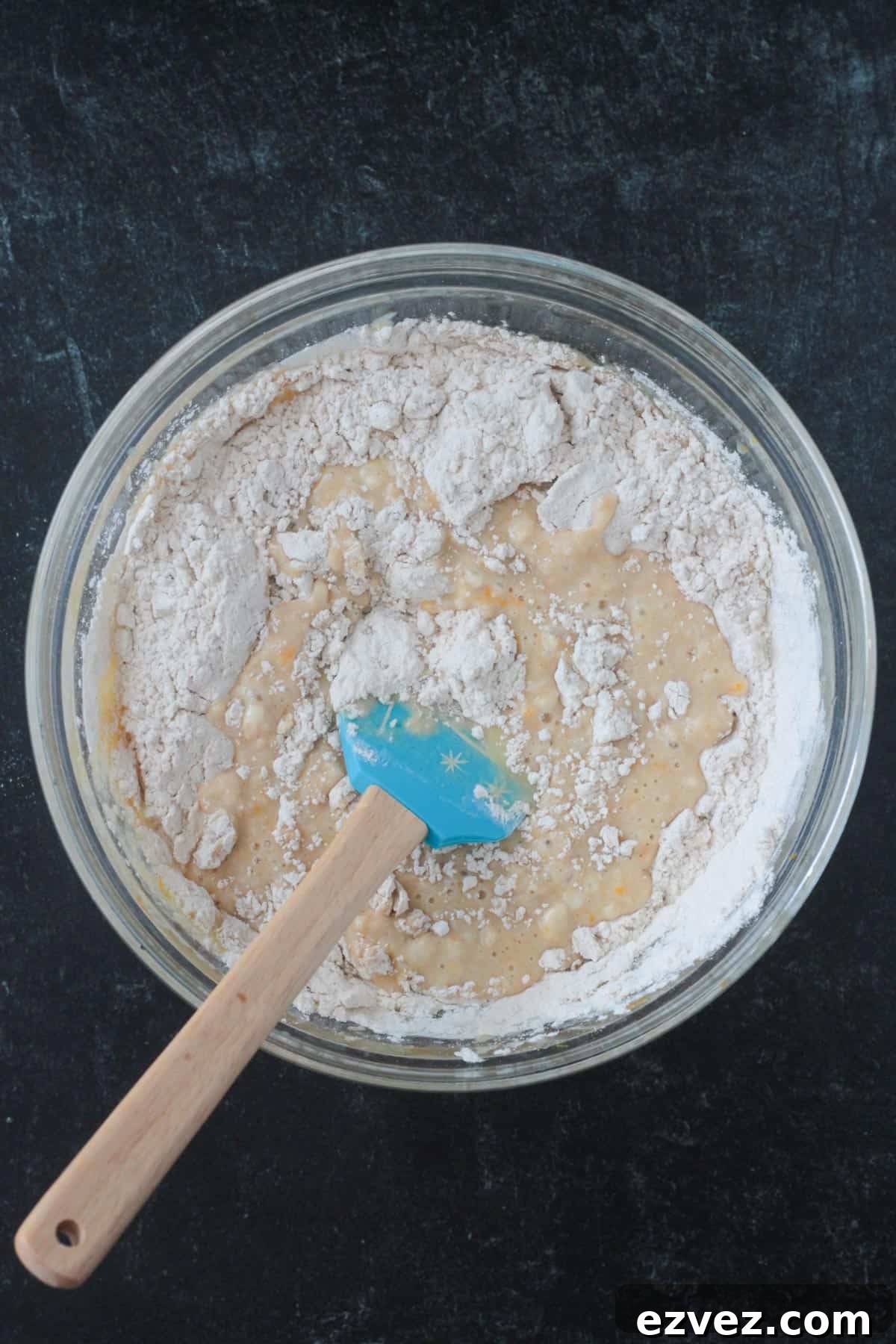 Combining the dry ingredients with the wet.