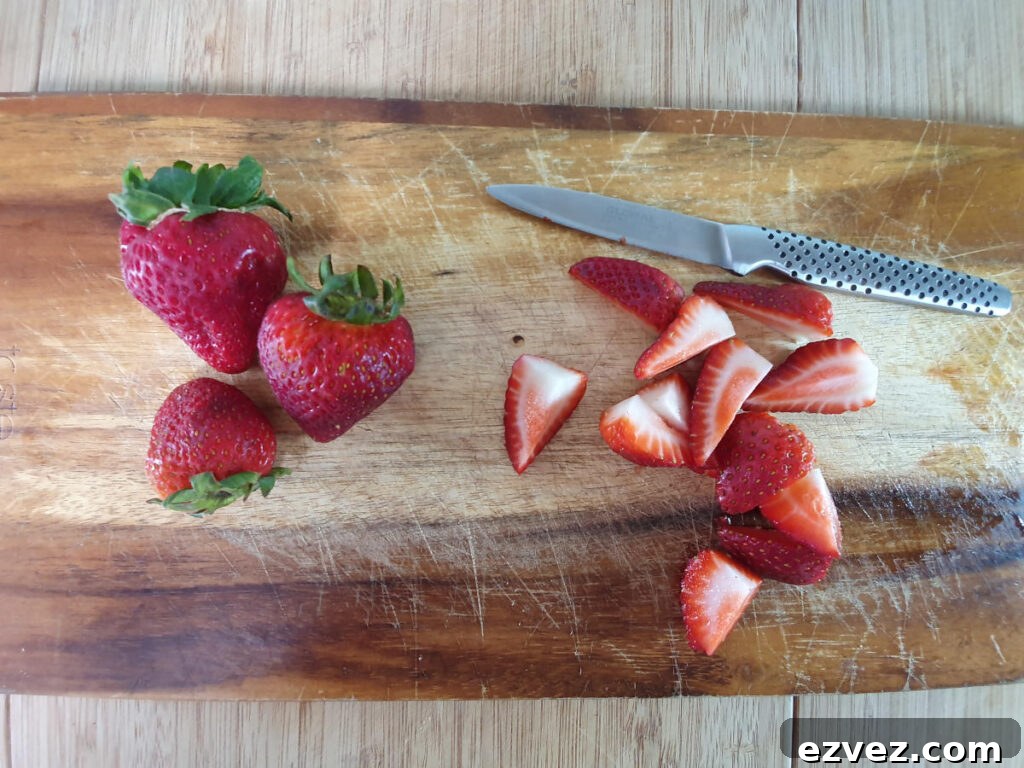 chopping strawberries.