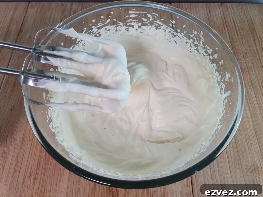 cream whipped into soft peaks.