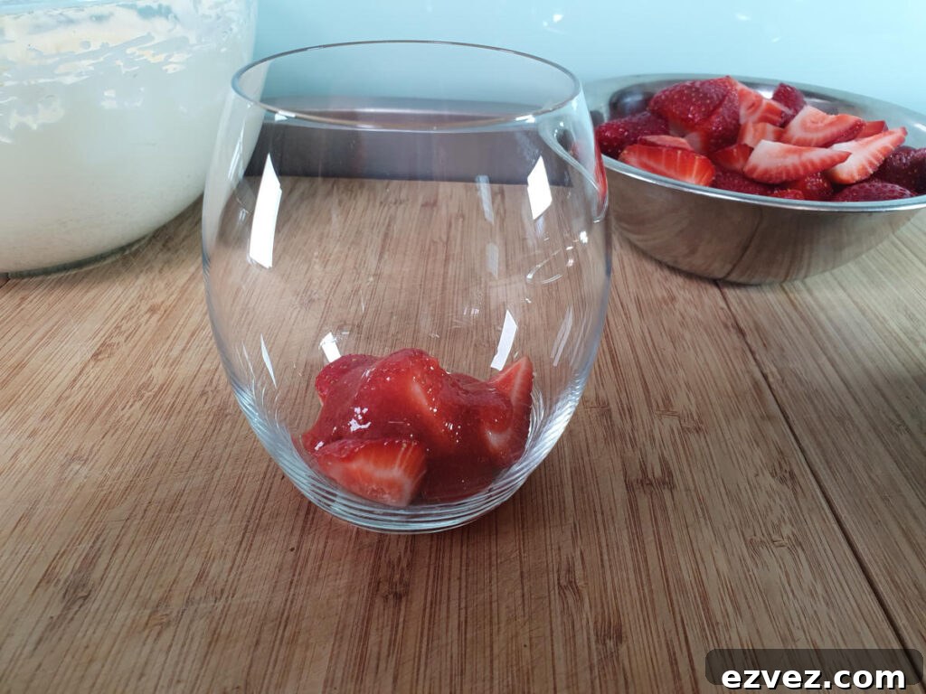 adding first layer strawberry sauce.