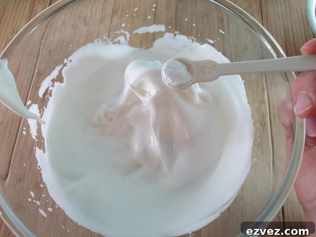 adding cream of tartar to whipped egg whites.