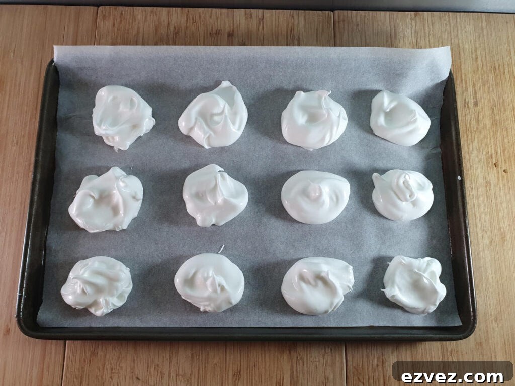 meringues on tray ready to bake.