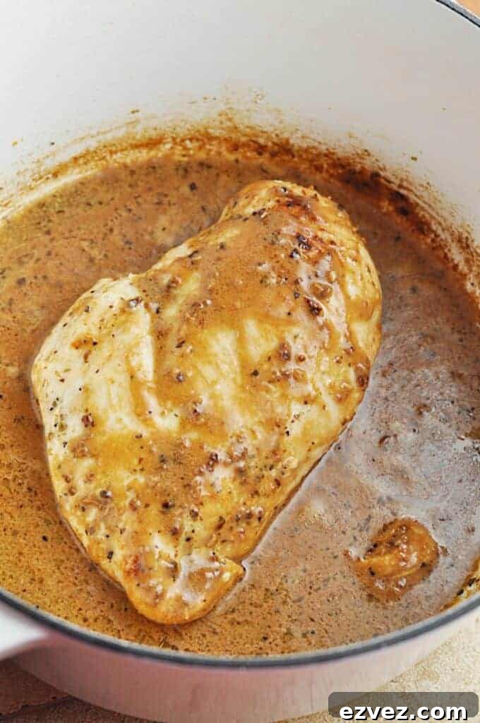 Garlic Butter Chicken Pasta with Golden Browned Flavor 4 Chicken cooking in buttery garlic sauce