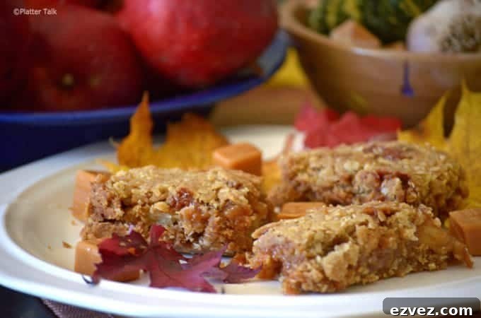 Chewy Caramel Apple Bars with Cinnamon Streusel 2 A plate of dessert bars on a table