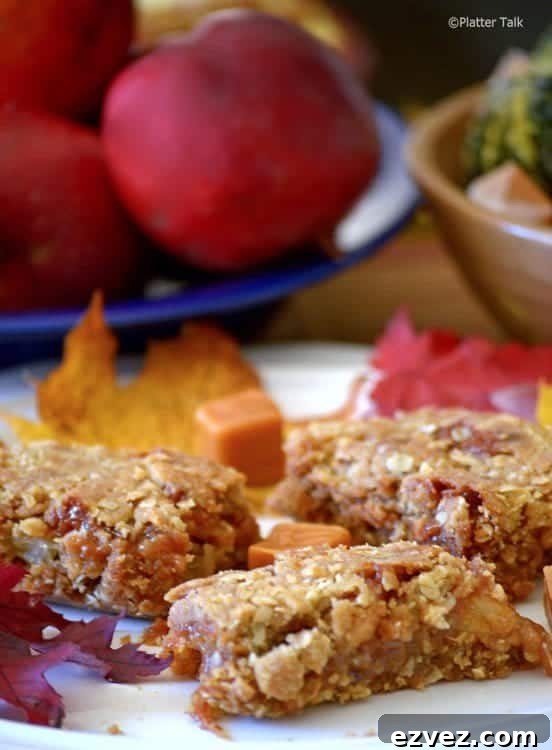 Chewy Caramel Apple Bars with Cinnamon Streusel 4 A close up of a plate of food, with Apple