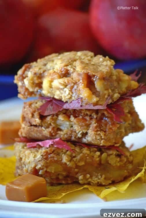 Chewy Caramel Apple Bars with Cinnamon Streusel 6 A close up of dessert on a plate