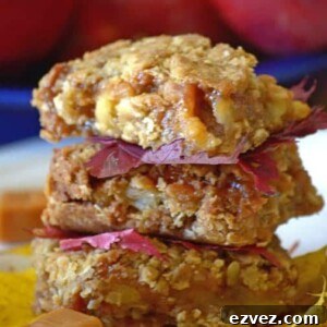 Chewy Caramel Apple Bars with Cinnamon Streusel 7 A close up of dessert on a plate