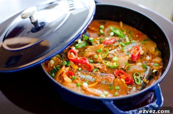 A pot of kimchi stew with canned mackerel is presented.