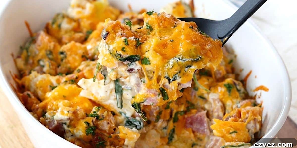 Creamy Ham and Rice Casserole Made with Leftover Ham 7 Serving the leftover ham casserole with a serving spoon.