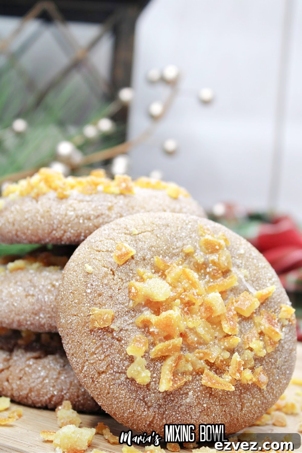 stack of orange gingerbread cookies on a wooden cutting board