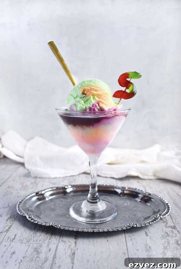 rainbow sherbet ice cream float in a martini glass on a silver tray