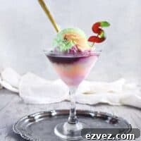 rainbow sherbet ice cream float in a martini glass on a silver tray