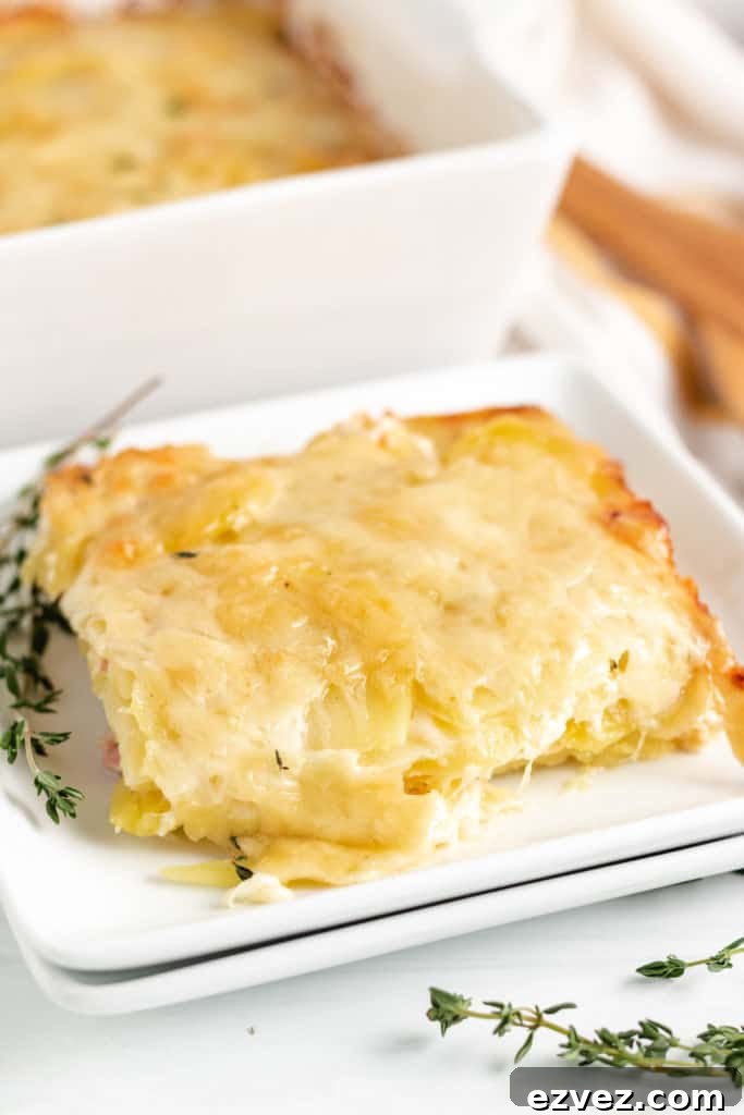 Scoop of potatoes au gratin on a serving plate.