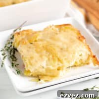 Two plates of cheesy potatoes au gratin.
