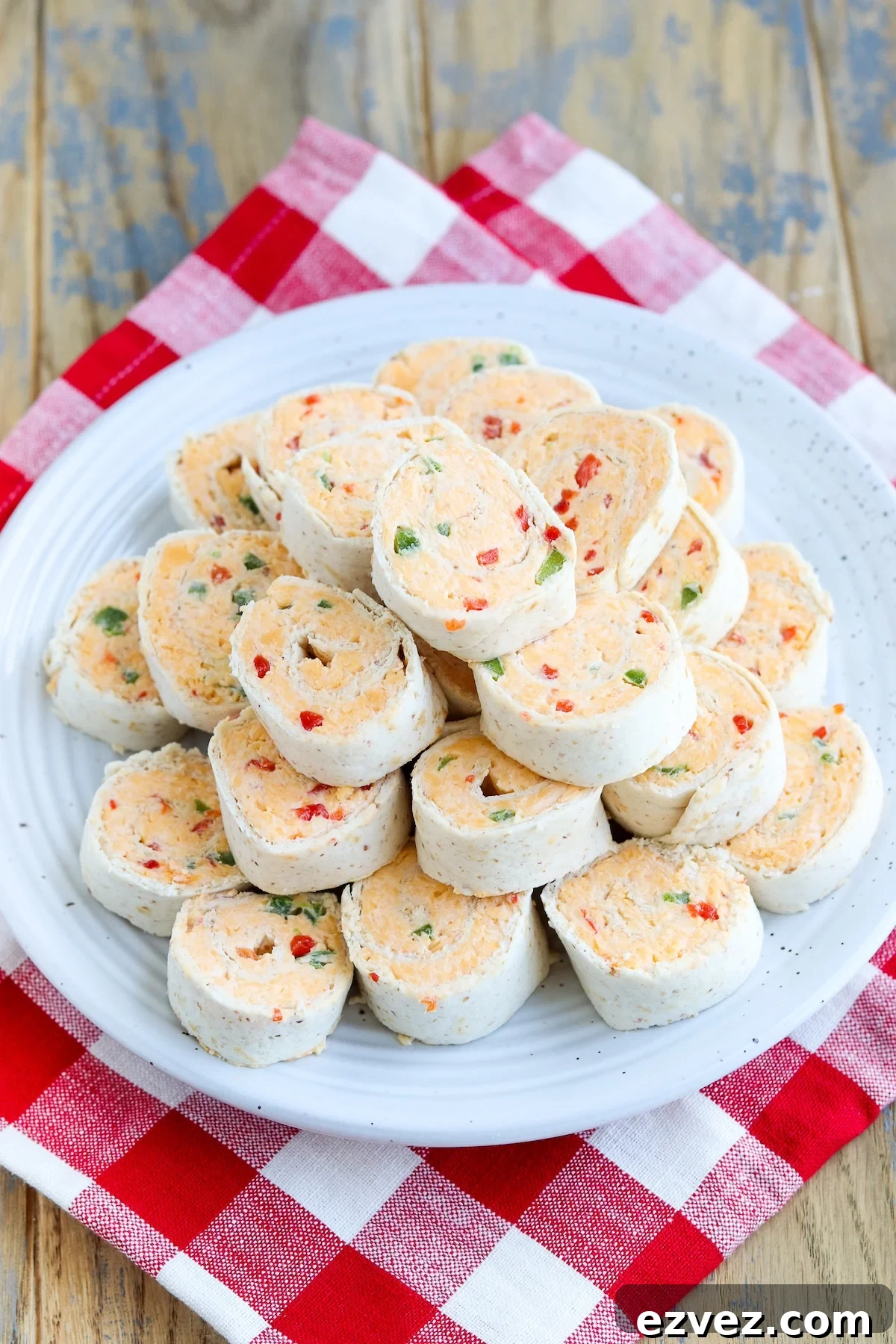 stack of prepared cheese pinwheels in flour tortillas