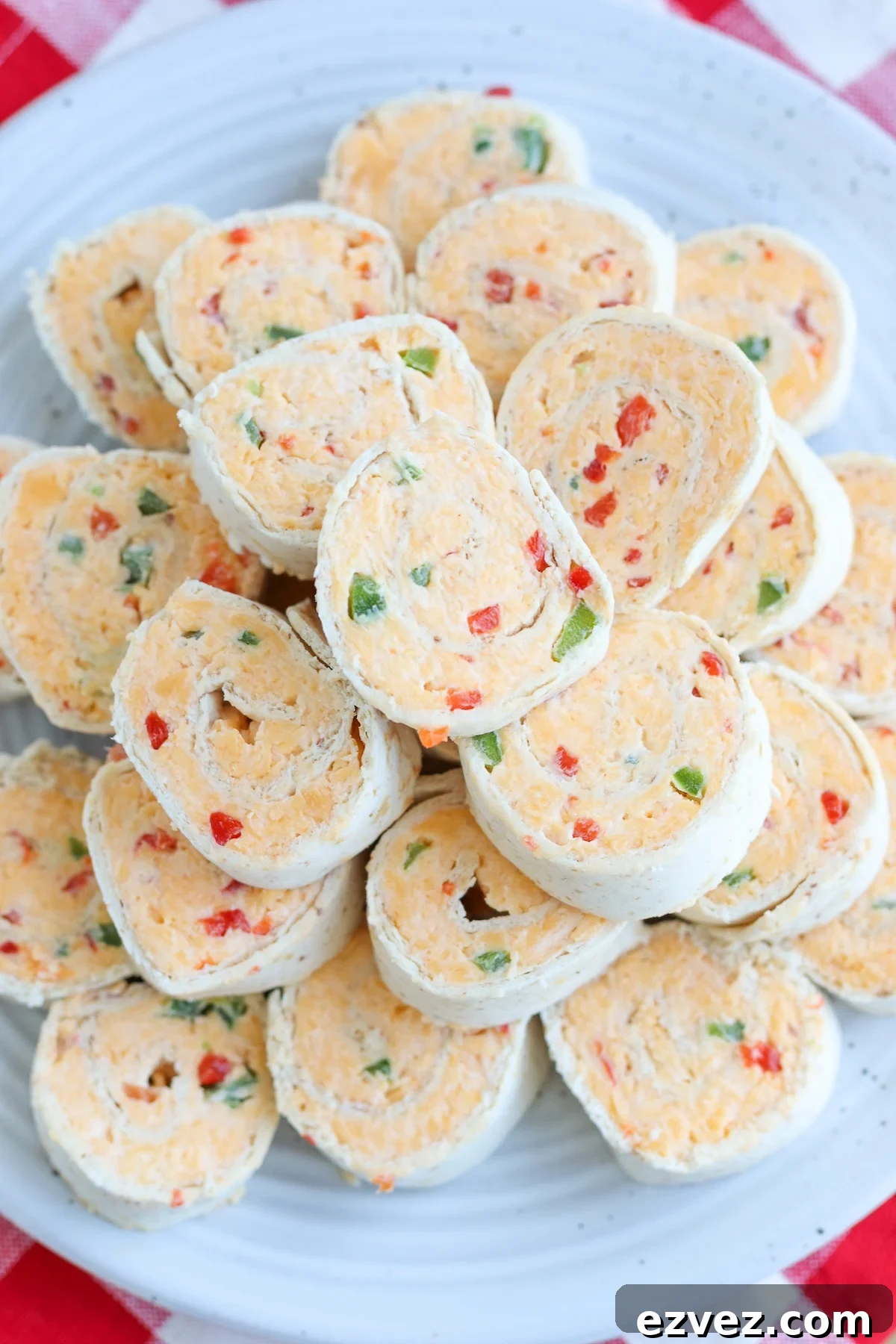 closeup of pimento cheese pinwheel with visible pimentos