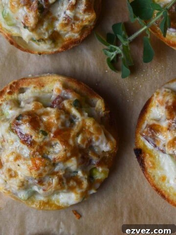 Overhead shot of tuna melts on parchment paper.