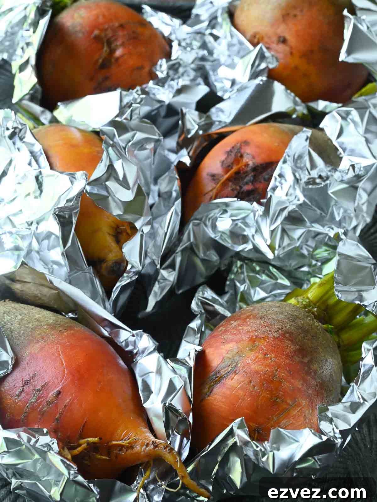 Beets wrapped in aluminum foil.