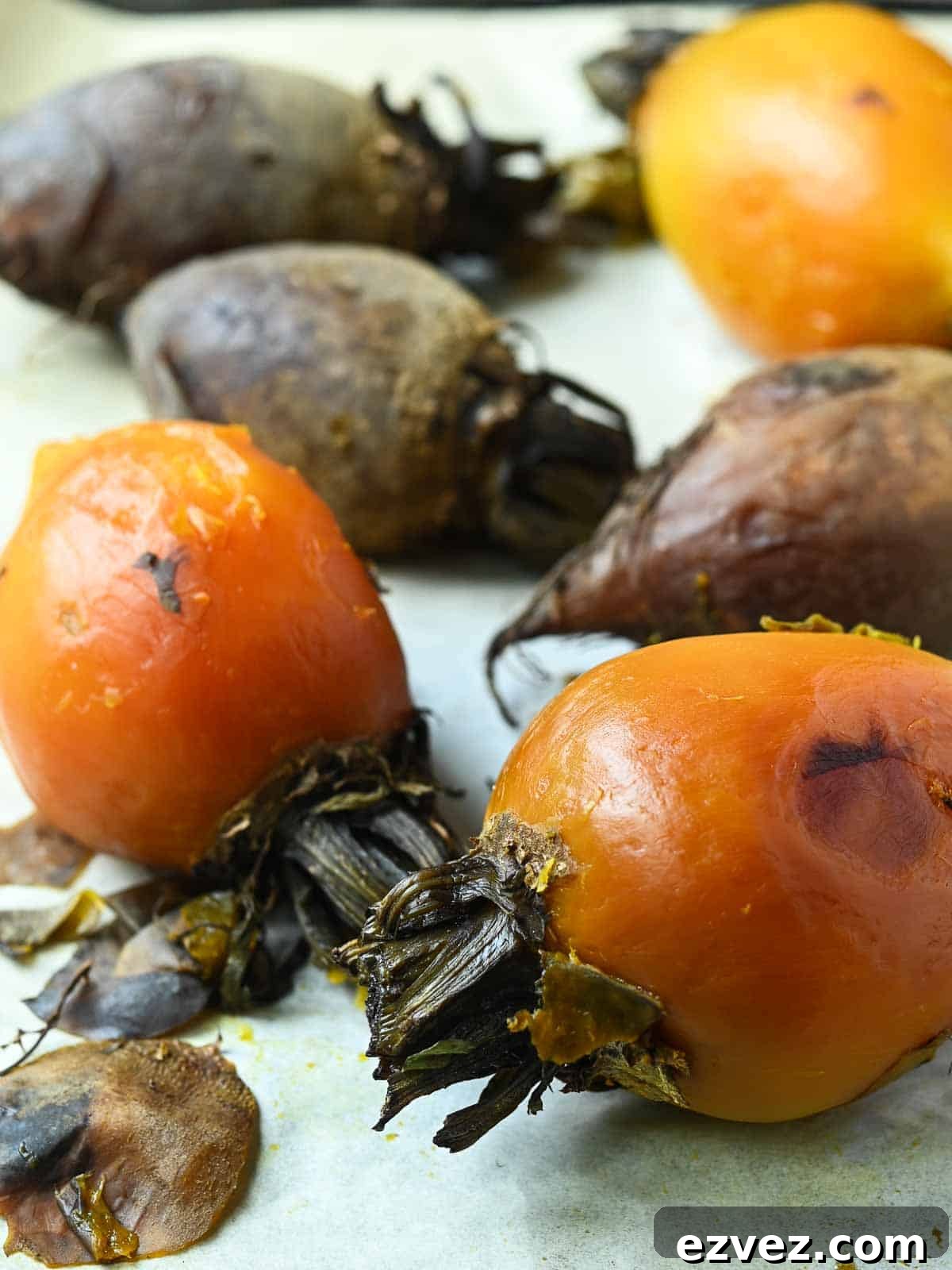 Peeled golden beets on parchment paper.