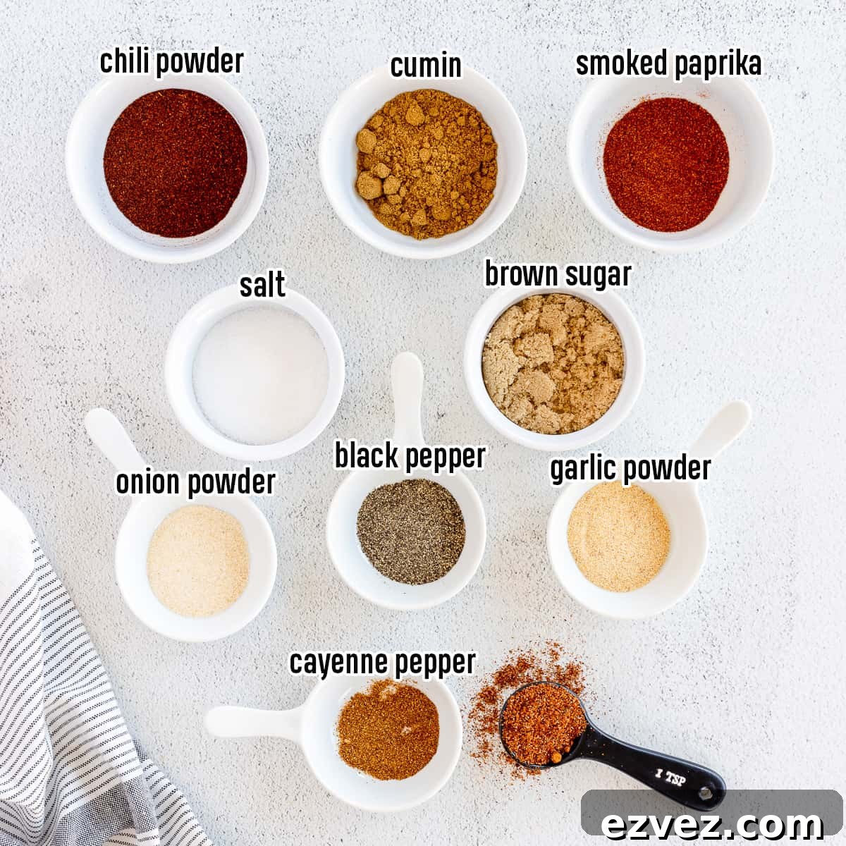 Homemade Fajita Seasoning Blend for Authentic Mexican Flavor 3 Spices in small bowls with text overlay.