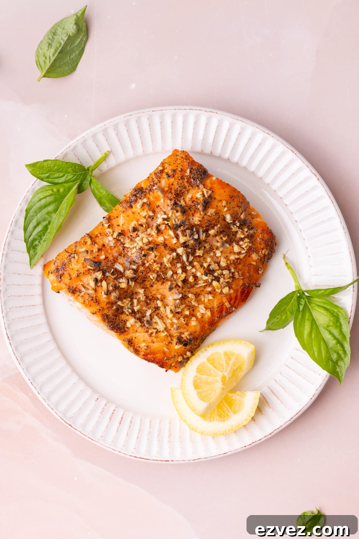 Overhead image of honey mustard salmon on a white ridges plate. 