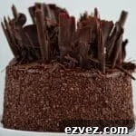Decadent Gluten-Free Chocolate Cake Recipe for Perfect Texture 20 whole gluten free chocolate cake on white cake stand with white background