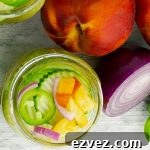 top of a jar of Sweet and Spicy Peach Jalapeno Pickles plus fresh produce