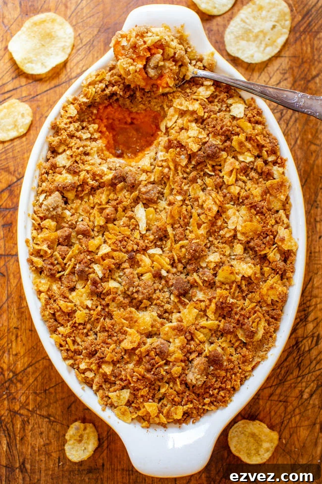 Sweet and Savory Sweet Potato Casserole — A fun and EASY twist on classic sweet potato casserole that uses potato chips in the topping for a SALTY-SWEET flavor the whole family will love!! Great for Thanksgiving and Christmas celebrations!!