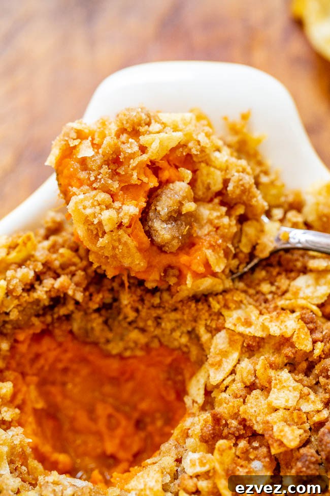 Sweet and Savory Sweet Potato Casserole — A fun and EASY twist on classic sweet potato casserole that uses potato chips in the topping for a SALTY-SWEET flavor the whole family will love!! Great for Thanksgiving and Christmas celebrations!!