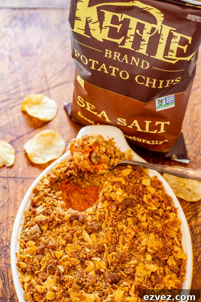 Sweet and Savory Sweet Potato Casserole — A fun and EASY twist on classic sweet potato casserole that uses potato chips in the topping for a SALTY-SWEET flavor the whole family will love!! Great for Thanksgiving and Christmas celebrations!!