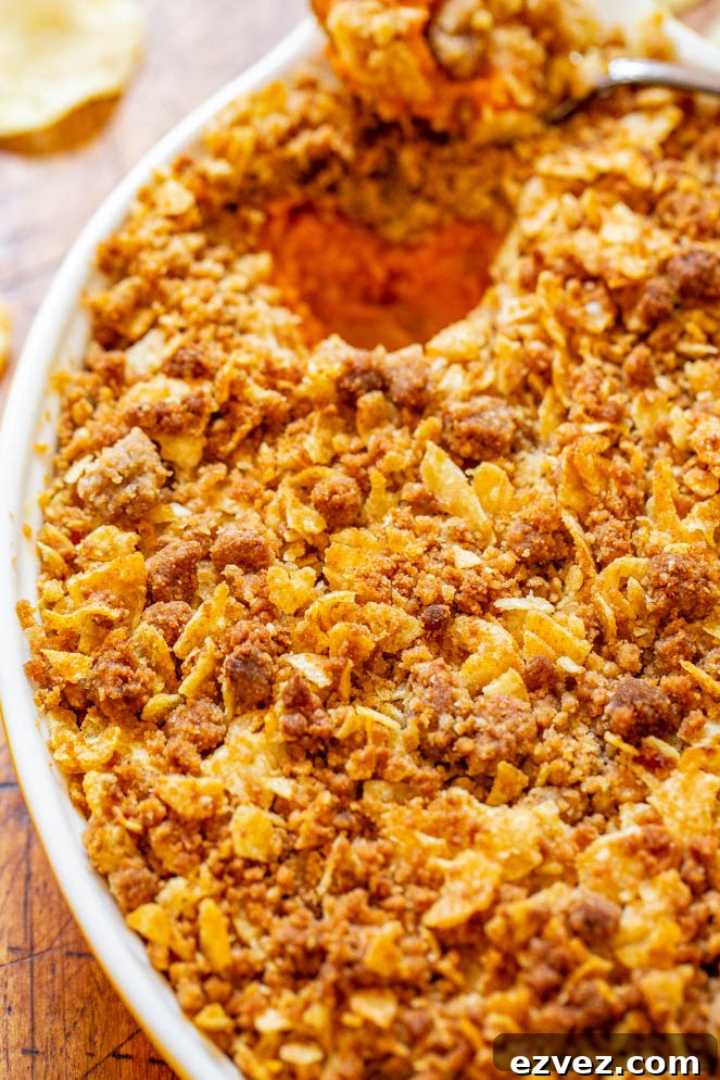 Sweet and Savory Sweet Potato Casserole — A fun and EASY twist on classic sweet potato casserole that uses potato chips in the topping for a SALTY-SWEET flavor the whole family will love!! Great for Thanksgiving and Christmas celebrations!!
