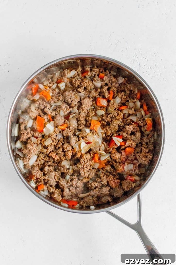 ground beef and taco seasoning added into a skillet