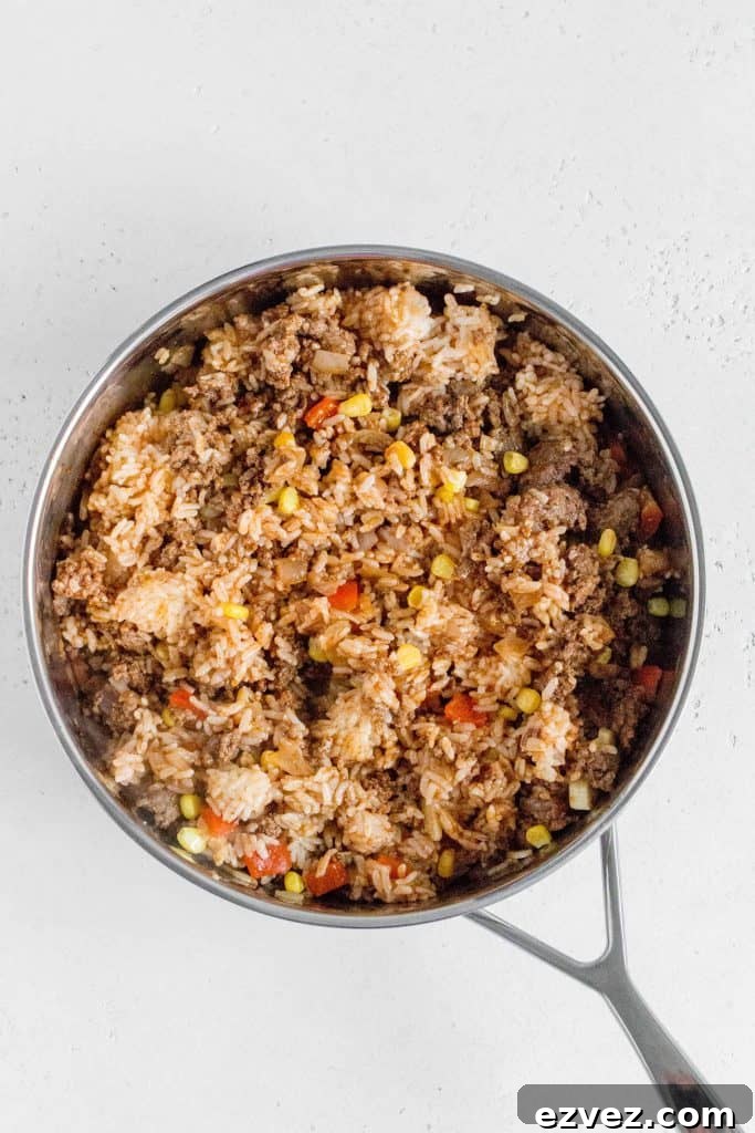 cooked leftover rice added to the skillet