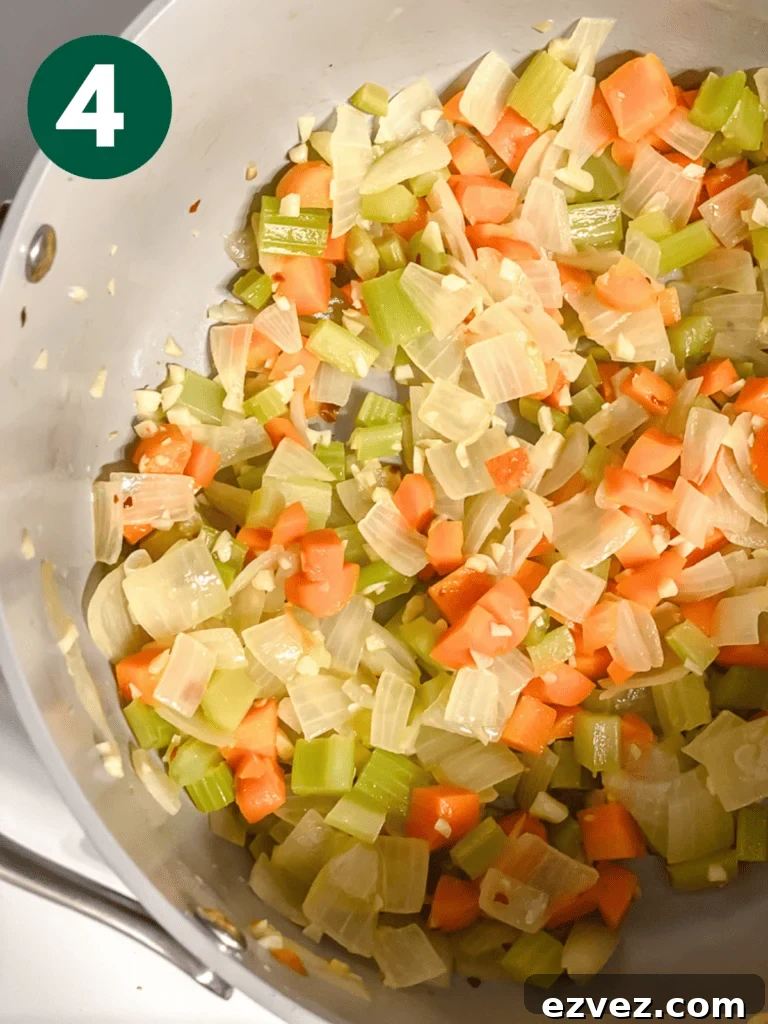 Hearty Spicy Lentil Soup Recipe with Warm Moroccan Flavors 7 process shot of veggies cooking in pan
