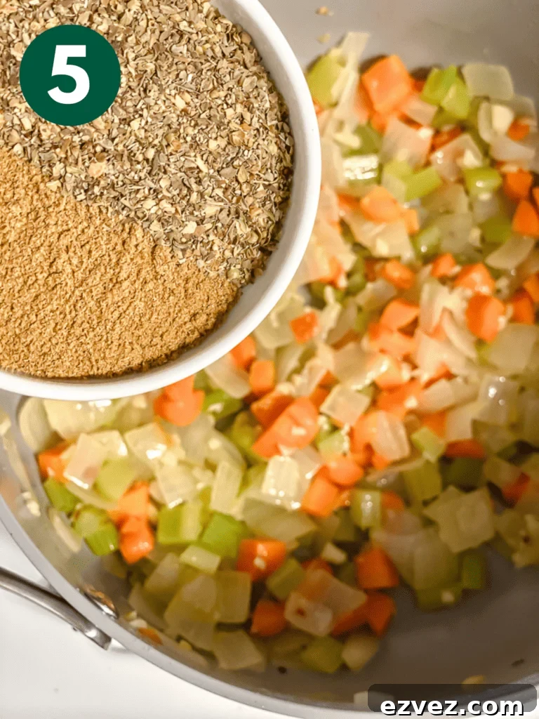 Hearty Spicy Lentil Soup Recipe with Warm Moroccan Flavors 8 process shot of adding spices to pan