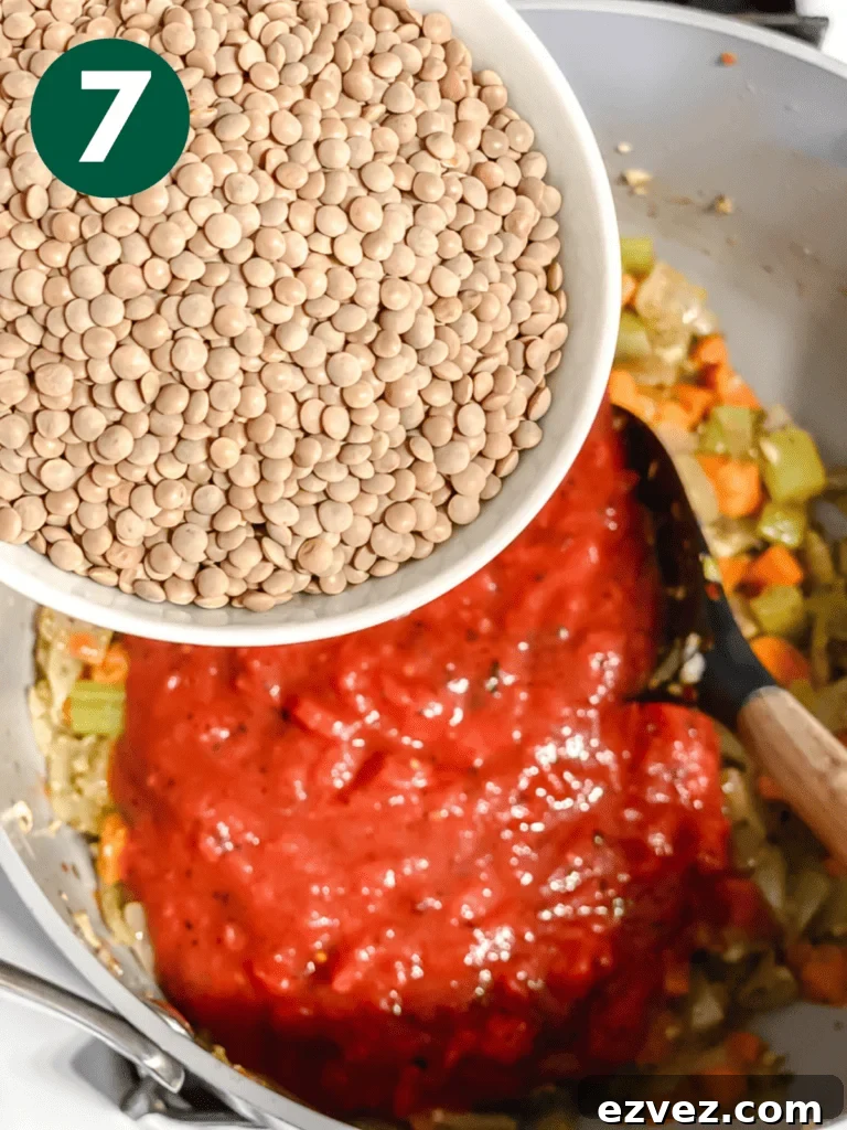 Hearty Spicy Lentil Soup Recipe with Warm Moroccan Flavors 10 process shot of adding lentils to pan