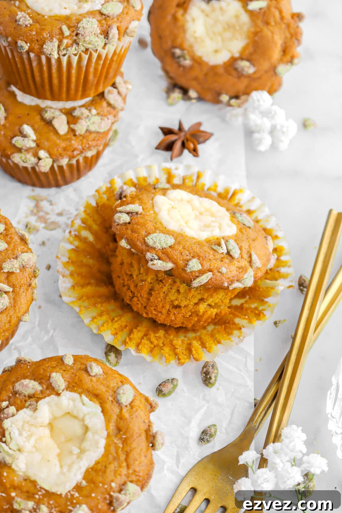 Pumpkin Caramel Poke Cake Recipe — Gooey Fall Dessert 11 pumpkin muffin with frosting.