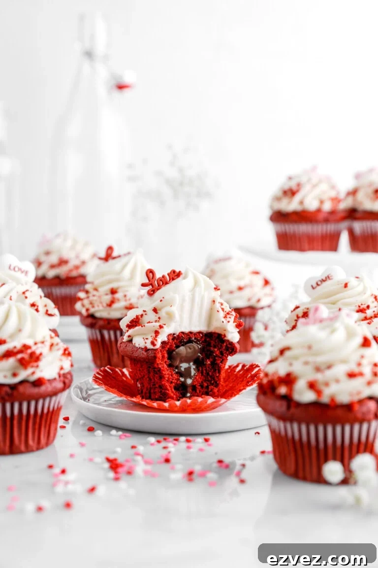 A red velvet cupcake with cream cheese frosting and molten chocolate center.