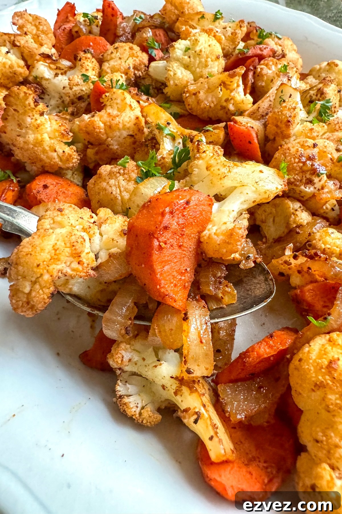 serving roasted cauliflower and carrots