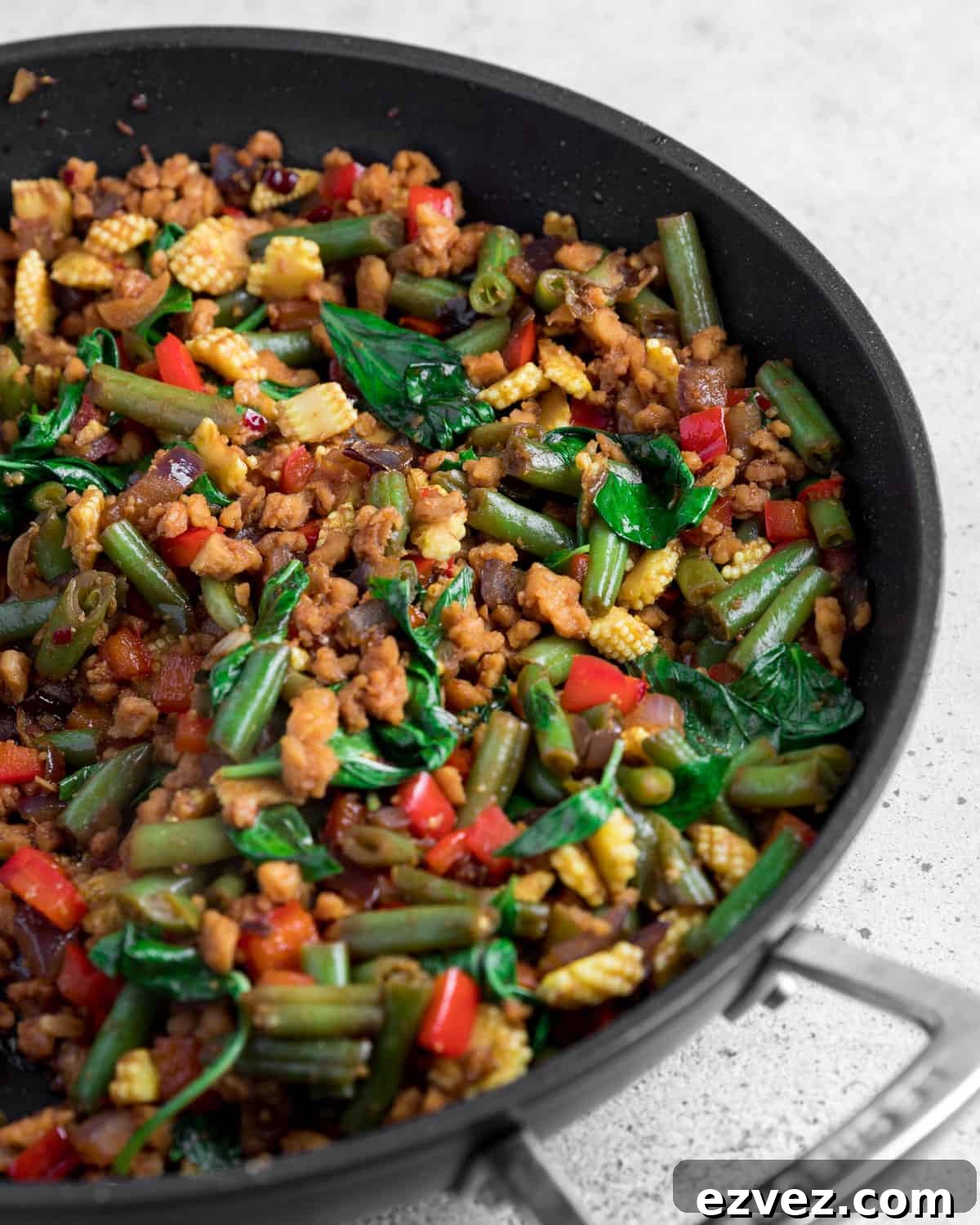 Close-up photo of thai basil vegan stir fry in the pan.