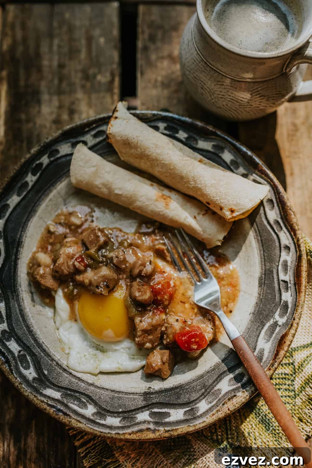 Colorado-Style Green Chile Pork Roast Recipe 9 Denver Pork Green Chile smothered over fried egg with a side of two corn tortillas and cup of coffee.