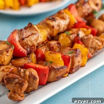 Teriyaki Chicken Skewers on a white platter.
