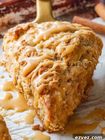 Baked maple caramel apple scone on parchment paper.