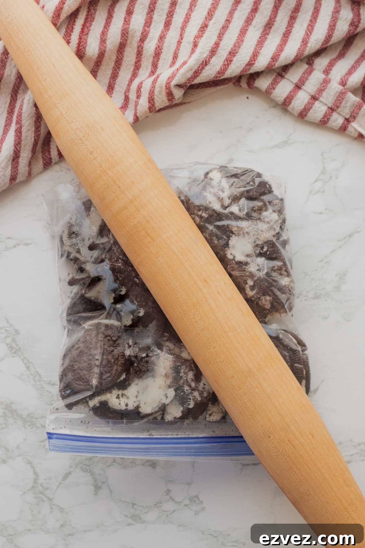 Spooky Halloween Pudding Cups Recipe for Party Treats 4 Rolling pin crushing bag of oreos.