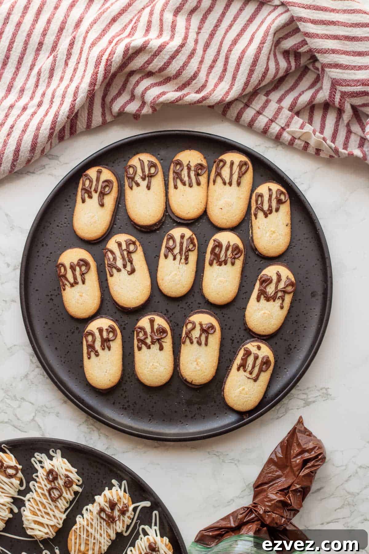 Spooky Halloween Pudding Cups Recipe for Party Treats 7 RIP letters on milano cookies on black plate.